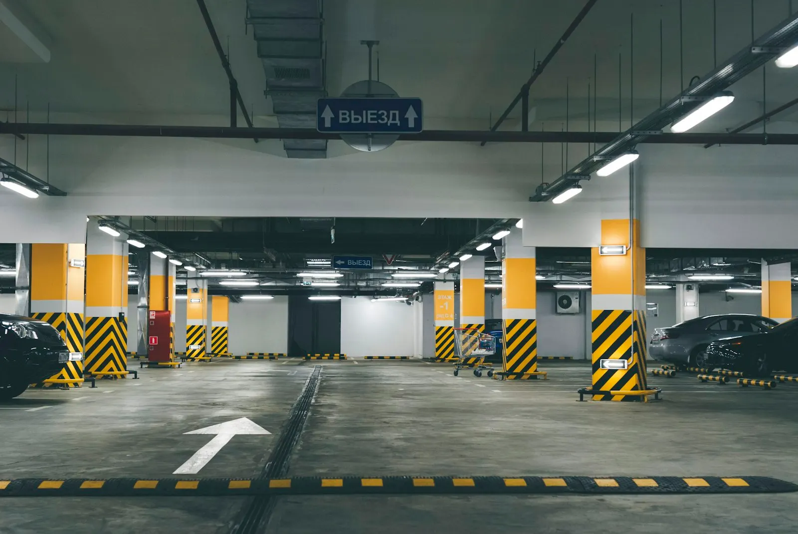 Well-lit underground car park with parking spaces